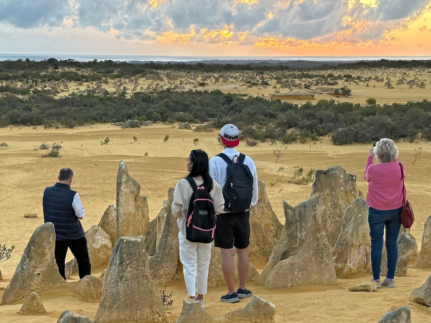 Standing atop the small dune, watching the sun set over the Indian Ocean