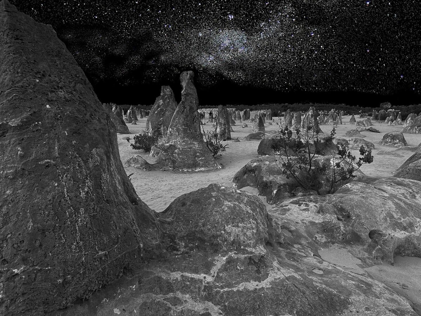 Composite photo of the Pinnacles with the night skies splayed overhead