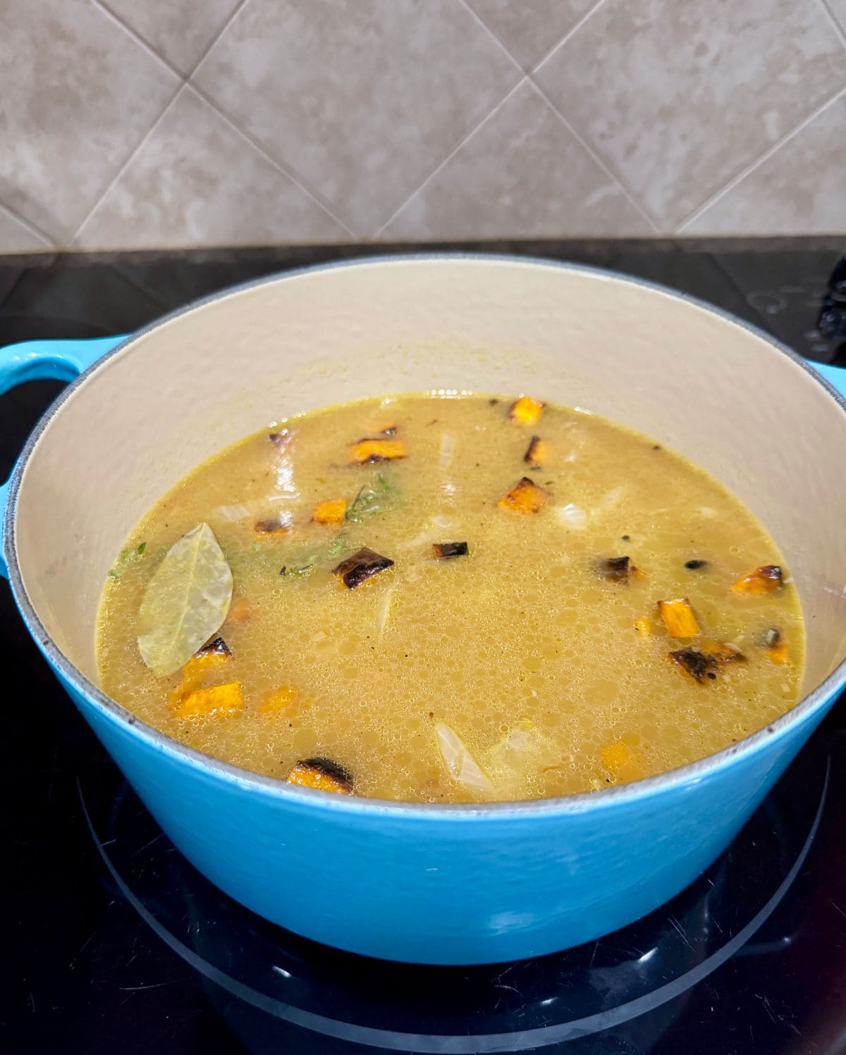 The broth of the butternut squash soup before blending.