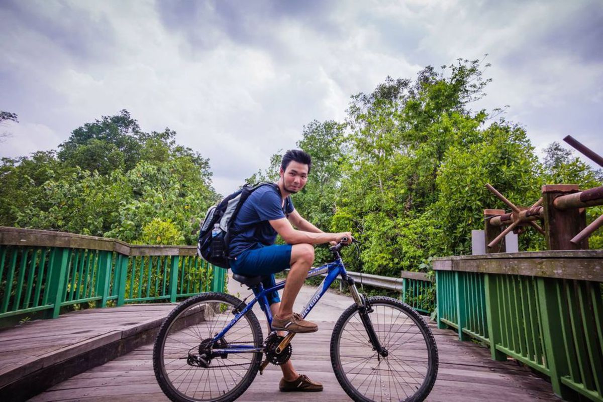 A person on a bike at Pulau Ubin in Singapore