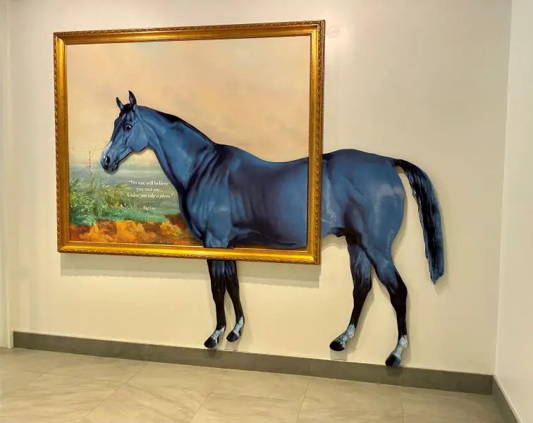 Big Blue Horse with a gold frame around it. Big Blue is the symbol of Lexington, the "Horse Capital of the World." Every visit to Lexington should start at the Lexington Visitor's Center.