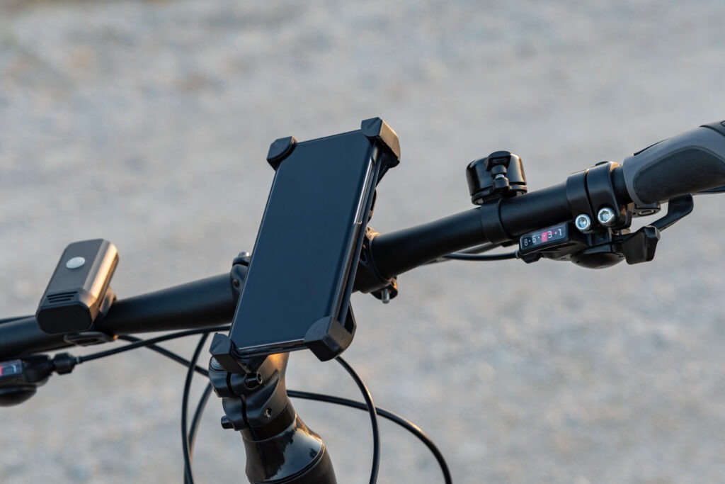 Close-up of a bicycle’s handlebar with a navigation device