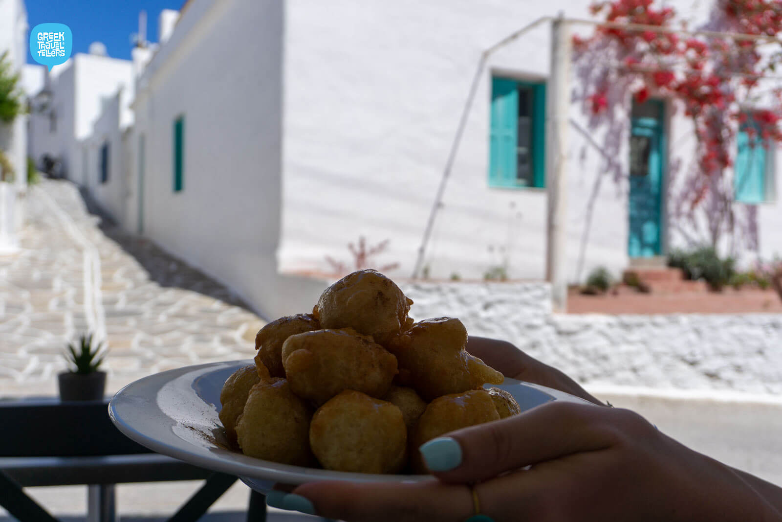 Enjoying sweet lukumades in Paros