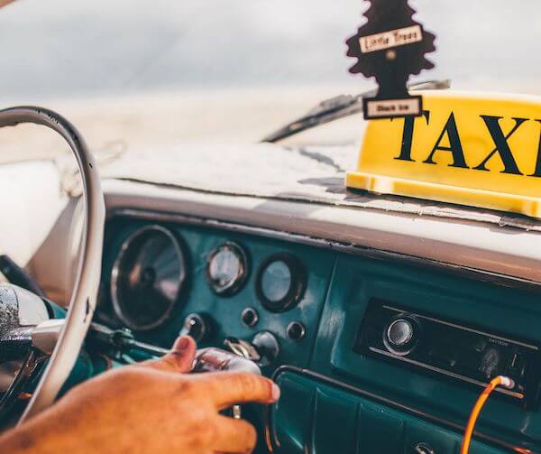 A driver at a steering wheel, a transport option from Ireland's airports