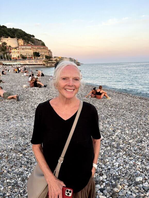 Catherine Sweeney at the beach at sunset in Nice, France