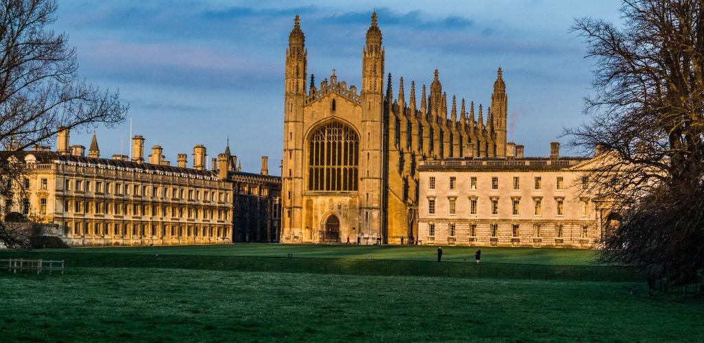 The historic University of Cambridge surrounded by beautiful scenery.