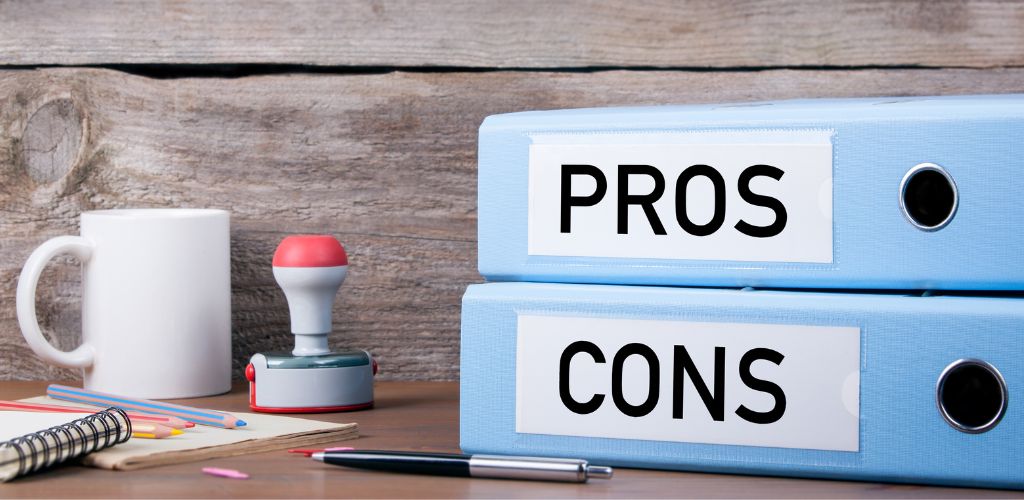 Pros and cons discussion materials on a desk.