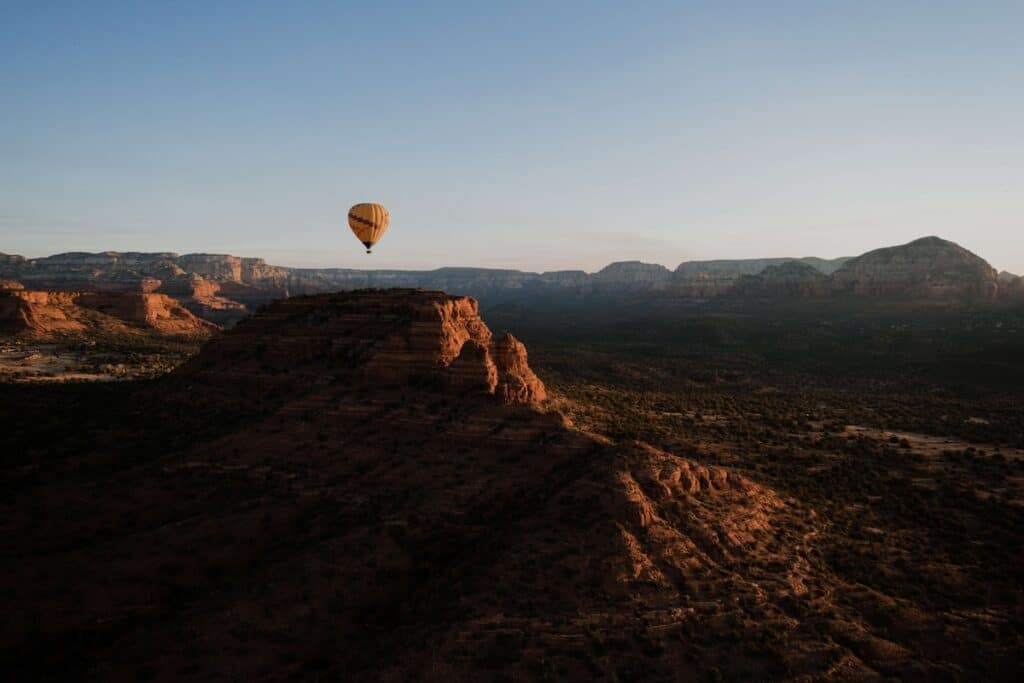 Hot air balloon over Sedona landscape