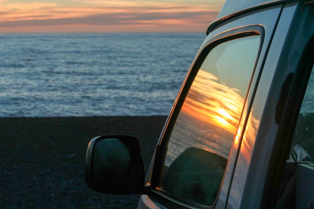 Sunset reflected in a campervan window