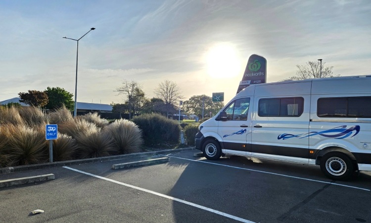 A campervan parked at a supermarket car park