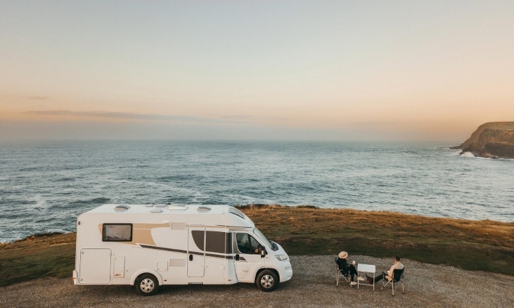 A couple freedom camping with their motorhome