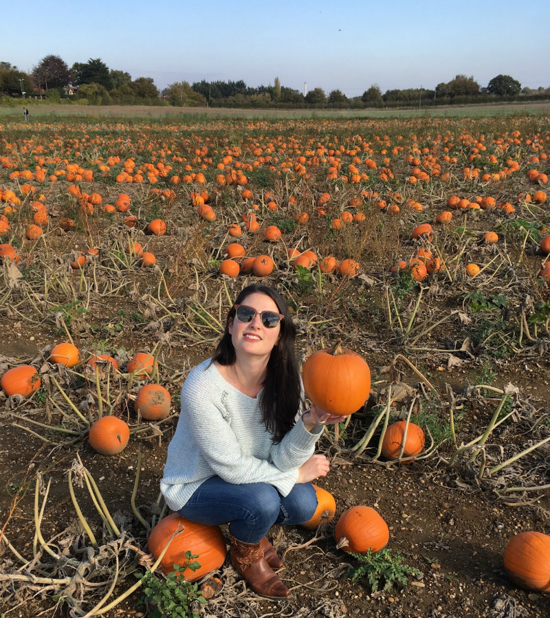 Elle Croft posing with pumpkin in field: Pumpkin Picking in Kent