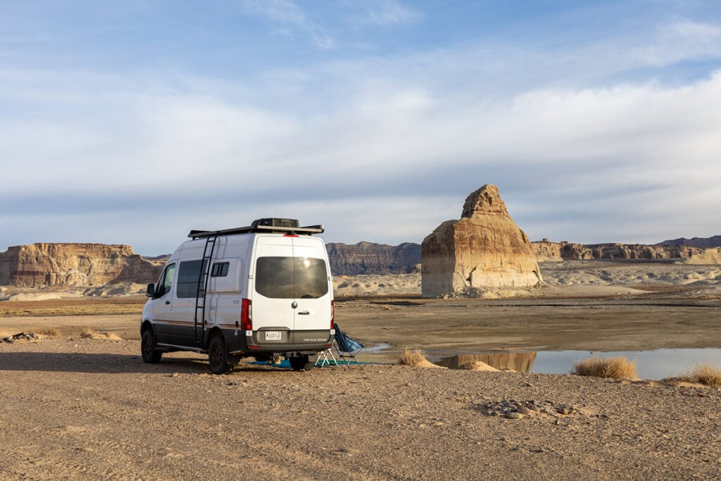 Van at a remote campsite in Lone Rock campground in Arizona