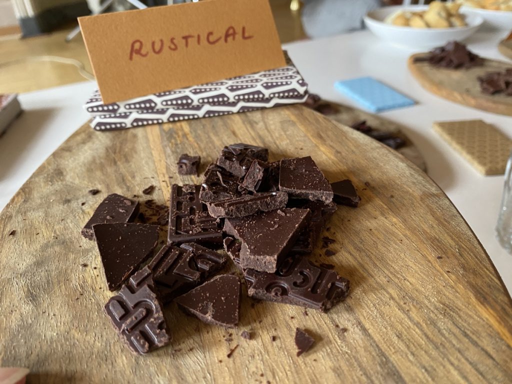 Taste testing Ajahla chocolate in Brno, featuring a rustic flavor with 100% cacao and cane juice