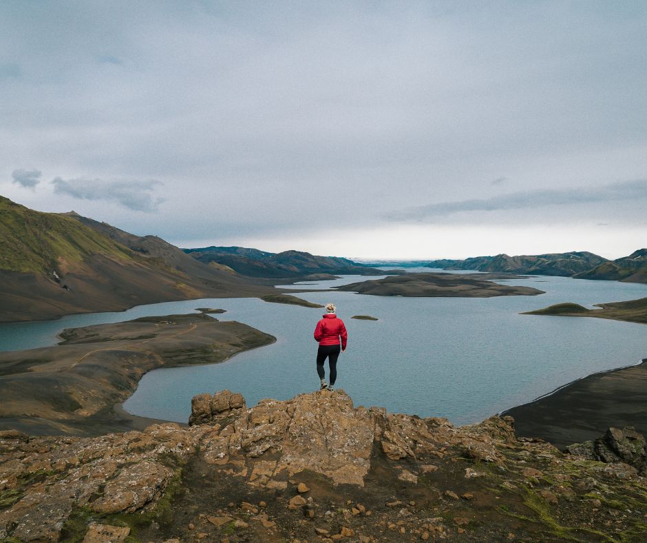 Jeannie wearing rain gear for Iceland on top of the Langisjor Highlands | Iceland with a View