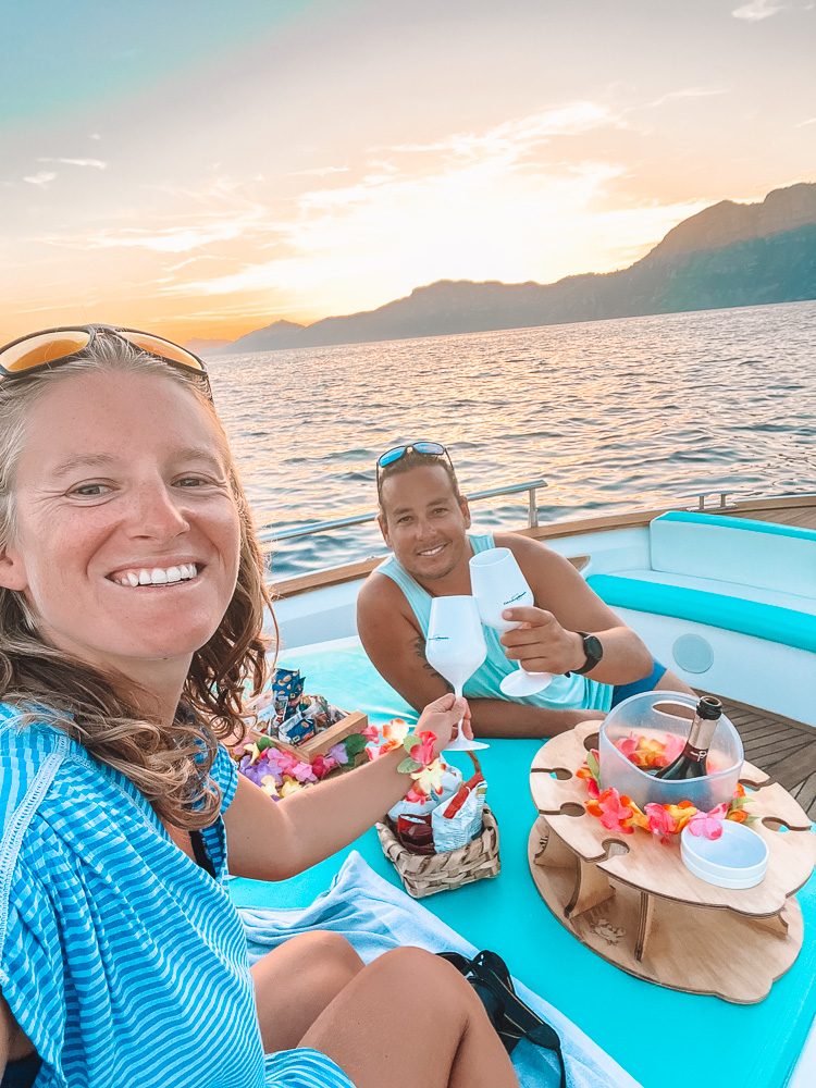 Enjoying our private boat tour in Positano at sunset, with Prosecco and snacks